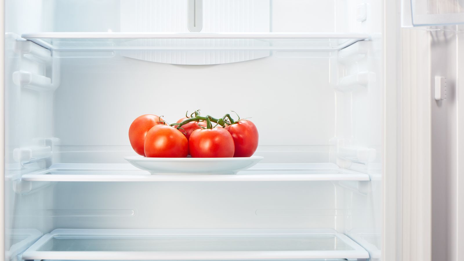 A shot of red colored fruits placed in the refrigerator