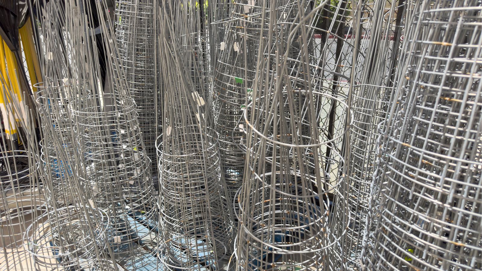 A close-up shot of a a large composition of several tower cage for crops
