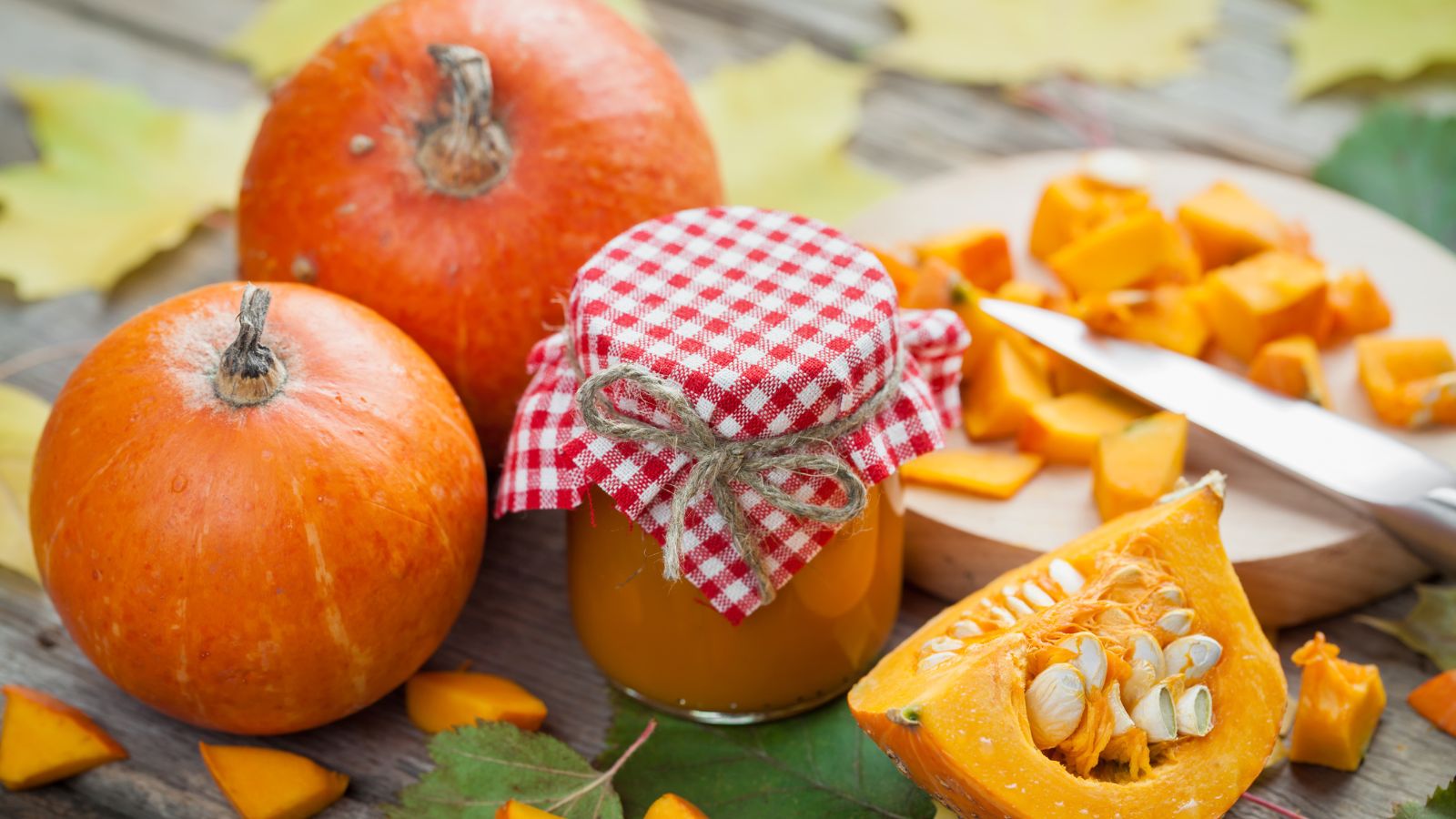A shot of raw orange crops alongside a jar in a well lit area